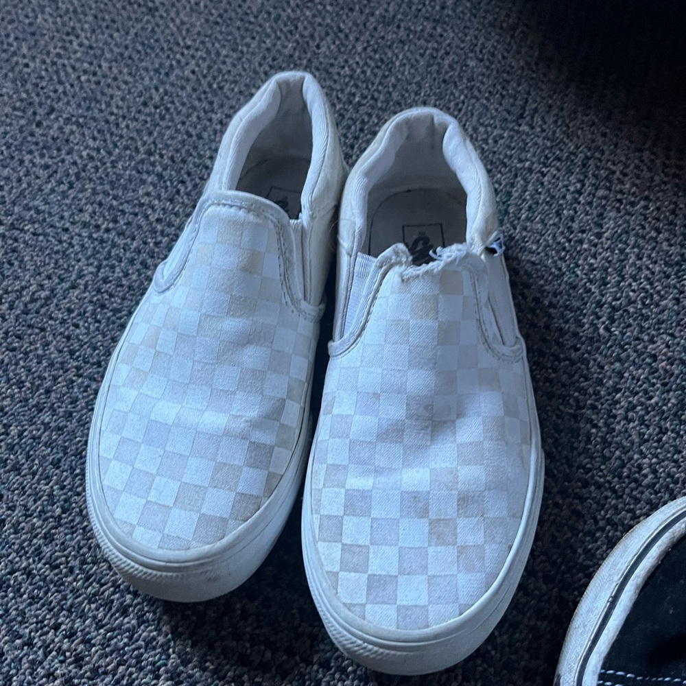 Distressed white checkered vans